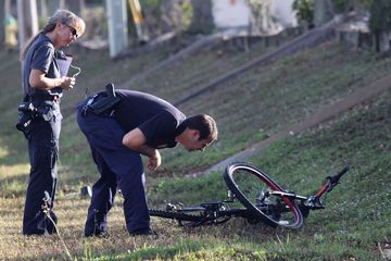Forensic Tech and Detective Investigate Bike Crash
