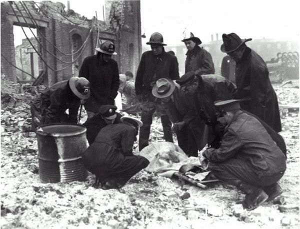 Firefighters Retrieve one of 131 Corpses